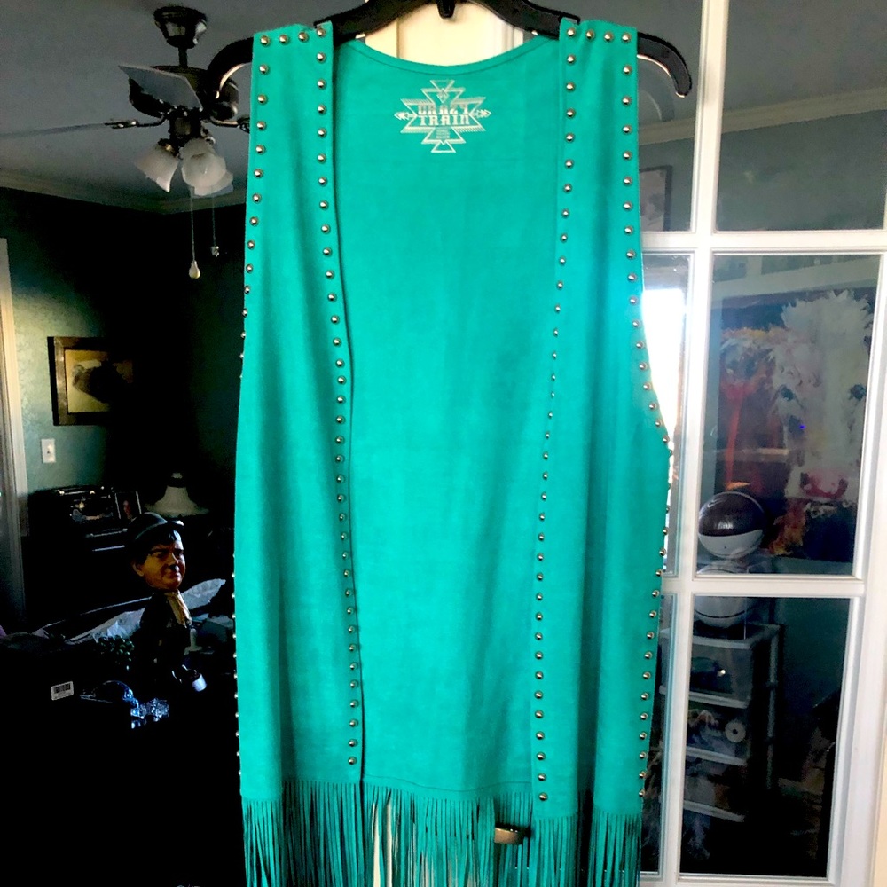 Faux suede vest with silver beads and fringe! It’s fabulous on!